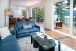 The Tree Haus living room features accordion doors with incredible views of Whitefish Lake.